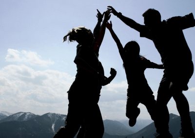 Group celebrating on mountain top