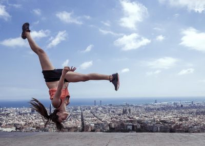 Young woman practicing parkour in the city of Barcelona